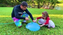 Nastya and dad play a fun outdoor game with slime