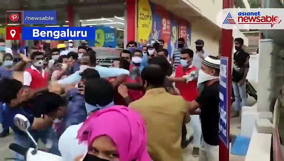 Angry Muslim youth attacks guard on duty for stopping him  from entering without a mask