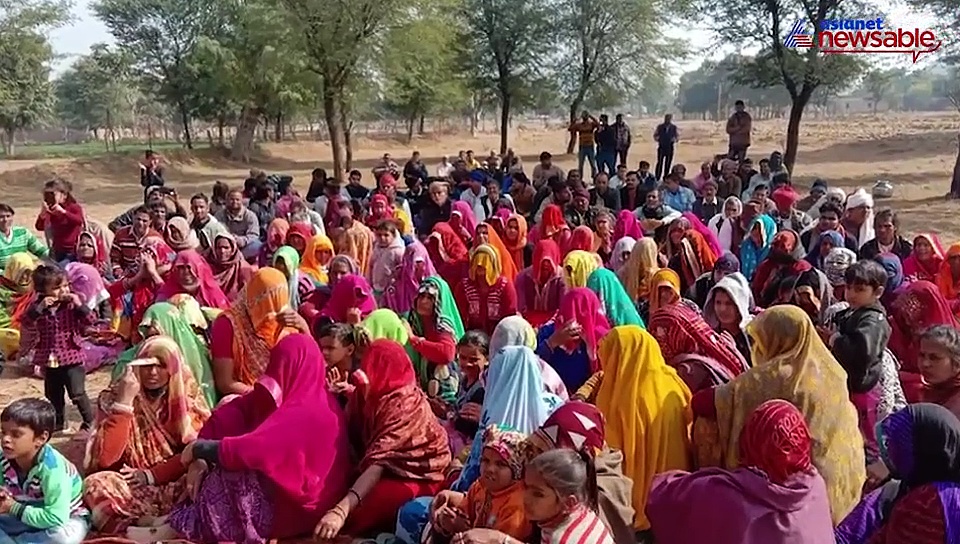 Nindar village farmers perform land samadhi satyagraha by burying themselves neck-deep in pits