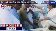 ips officer in uniform touches the feet of mamata banerjee