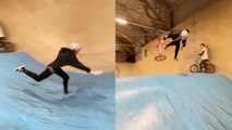 'BMX girl lets go of her bike in mid-air while attempting a cool flip '