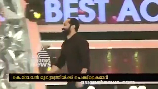 Actor Parvathy falls at Mollywood Superstar Mammooty's feet in the 20th Asianet Film Awards