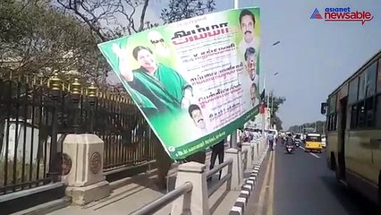 Cop tears down AIADMK hoarding blocking Chennai's Marina road