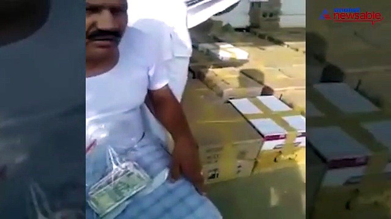 TN MLA seen distributing alcohol and money to gather crowds for MGR centenary celebrations