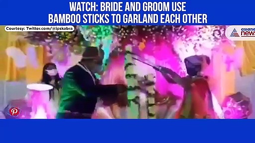 Unique Marriage: Couple exchange Garlands using bamboo sticks to Maintain Social Distancing; Watch Video