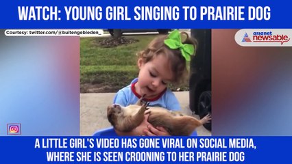 Young Girl Singing to Prairie Dog
