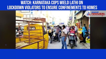 下载视频: Watch: Karnataka cops wield lathi on lockdown violators to ensure confinements to homes