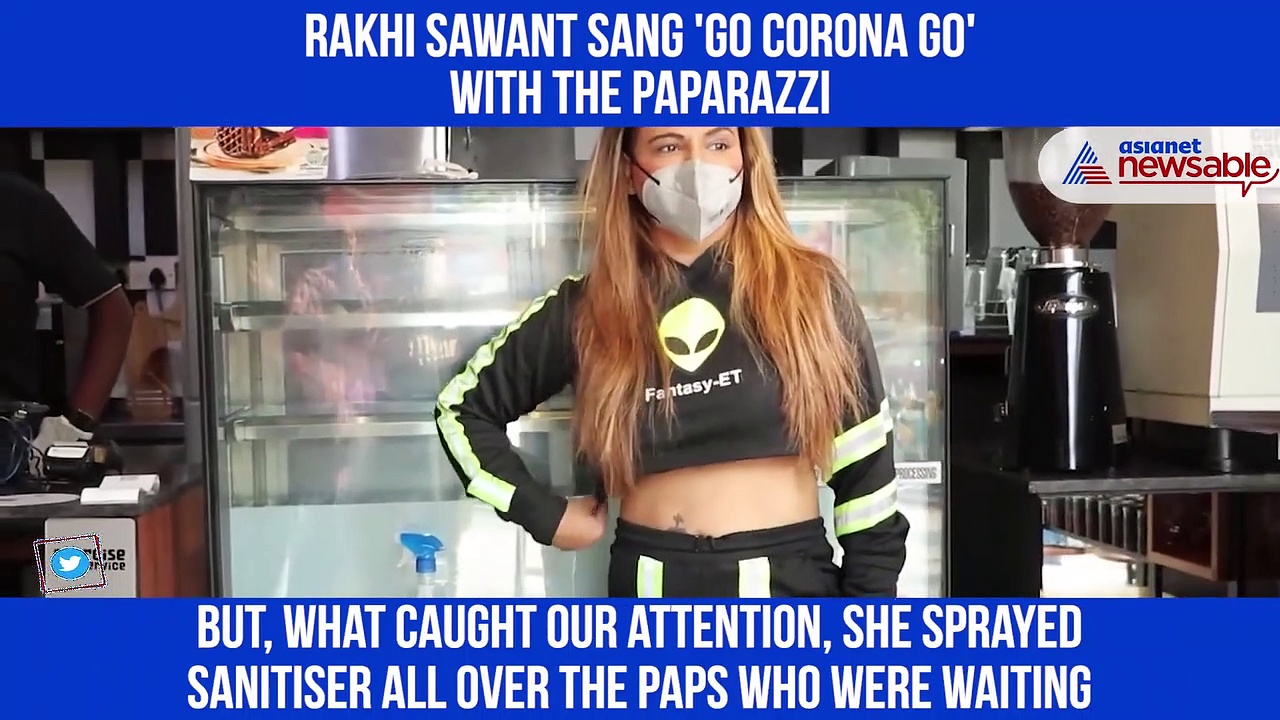 Rakhi Sawant steps outside, maintaining all COVID-19 precautions; sings 'Go Corona Go' with paparazzi