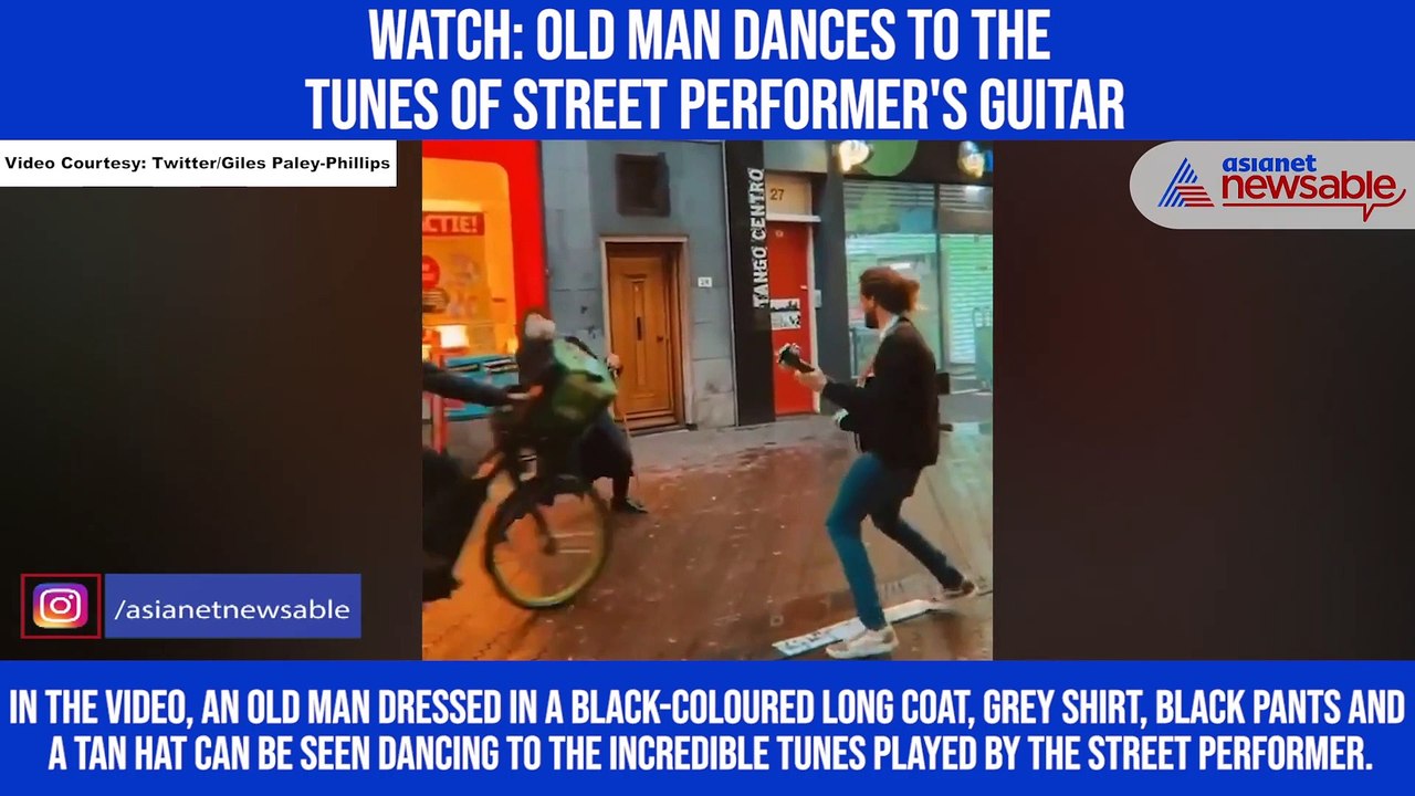 Watch: Old man dances to the tunes of street performer's guitar
