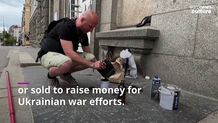 Meet the Ukrainian artist ordered to paint the war-torn streets of Kharkiv