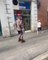 Guy Roller Skates On Streets While Balancing Ball On His Head