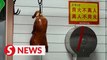 Beijing locals keep dining on duck despite Covid-19 concerns