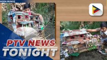 Tattoo artist makes diorama of miniature shanty type of shelters