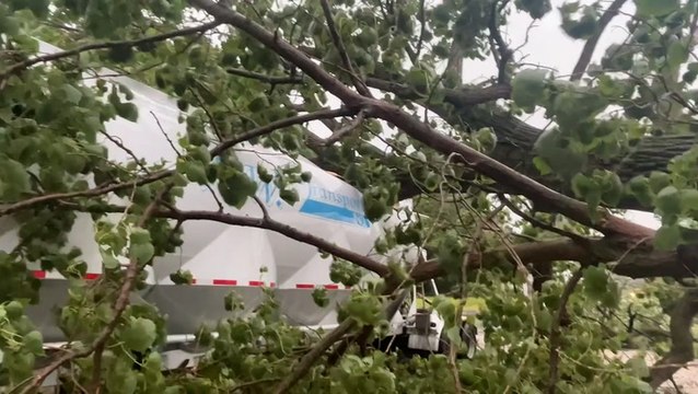 Gas stations and trucks damaged after severe weather