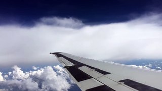 Jet_Airliner_Flies_Through_Clouds