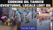 Edible oil tanker overturns on Mumbai-Ahmedabad highway, locals loot spilling oil | OneIndia News