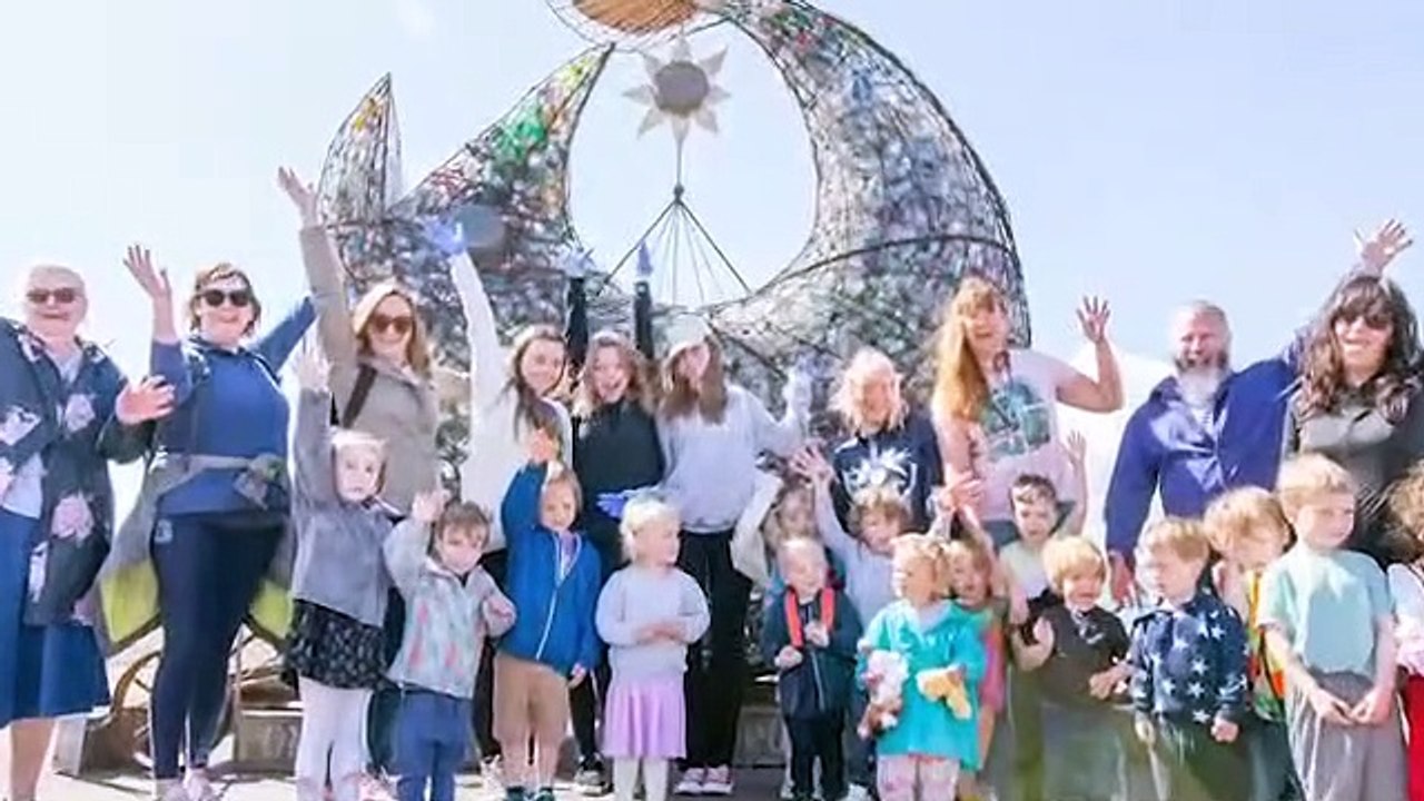Nursery children and charity groups volunteer to empty the Treadgold Fish Sculpture, Southsea on Tuesday 24th May 2022