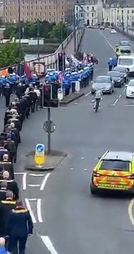 Celtic fan cycling past Loyal Order parade into town in Derry goes viral