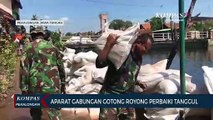 Aparat Gabungan Gotong Royong Perbaiki Tanggul