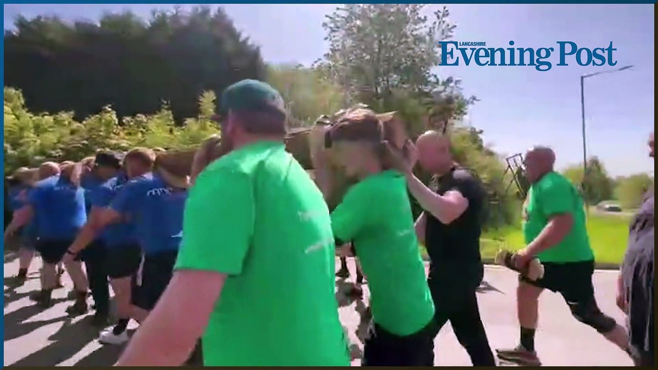 Lancashire Post news update: Why 35 men carried a 62 stone telegraph pole around Chorley