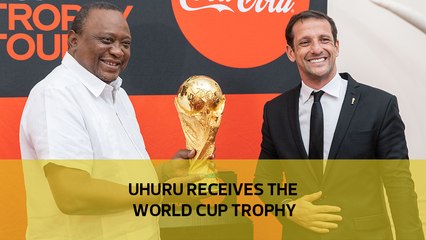 Uhuru receives the World Cup trophy