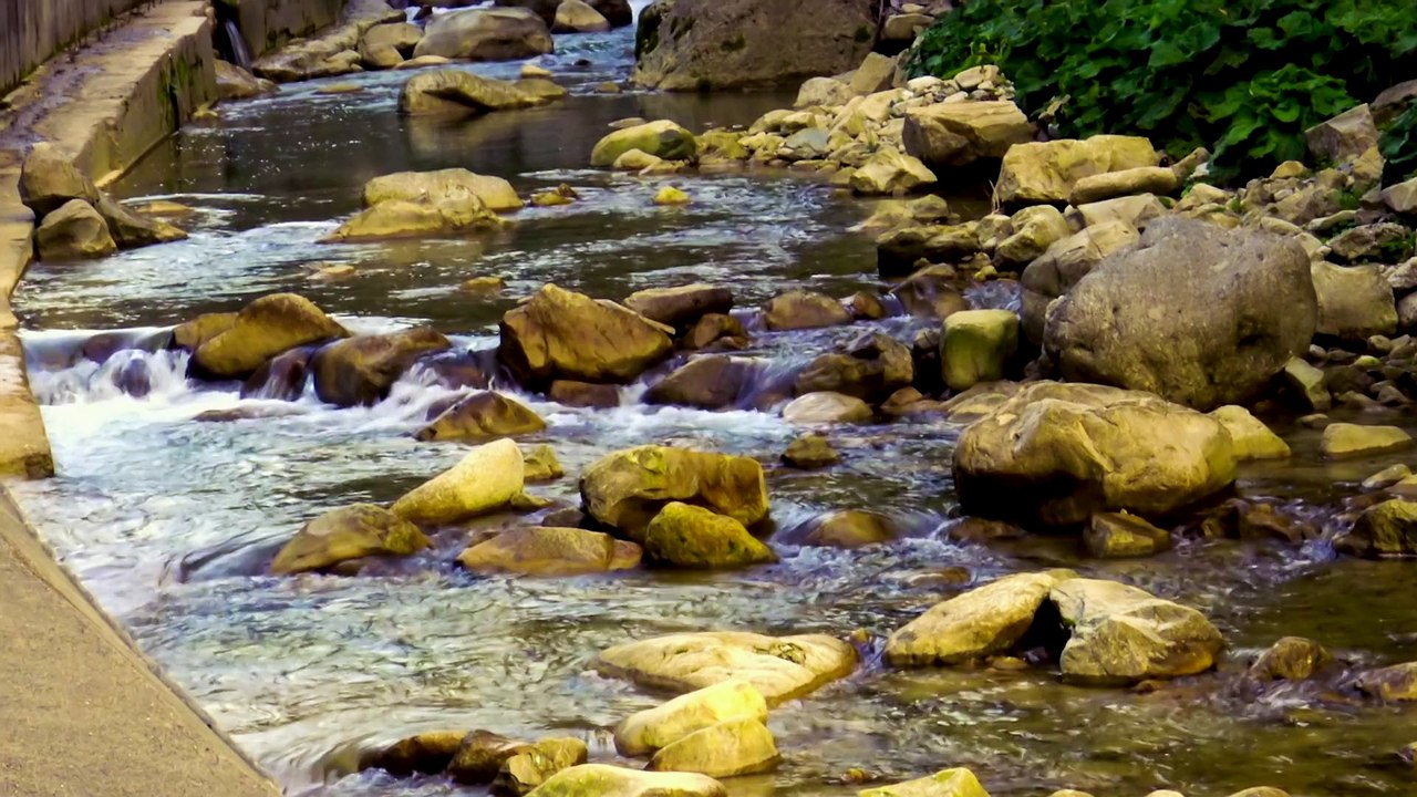 Mountain river Ugar is passing over rocky landscape.