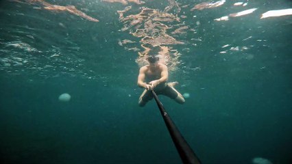 Man Snorkeling Gets Stung by Jellyfish