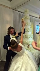 Groom Smashes Cake in Bride's Face