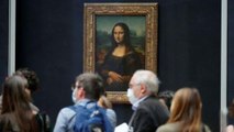 Man dressed as old woman smears cake on Mona Lisa portrait at Louvre in Paris