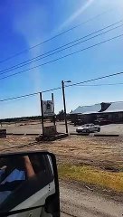Very Large Dust Devil Picks up Tumbleweeds