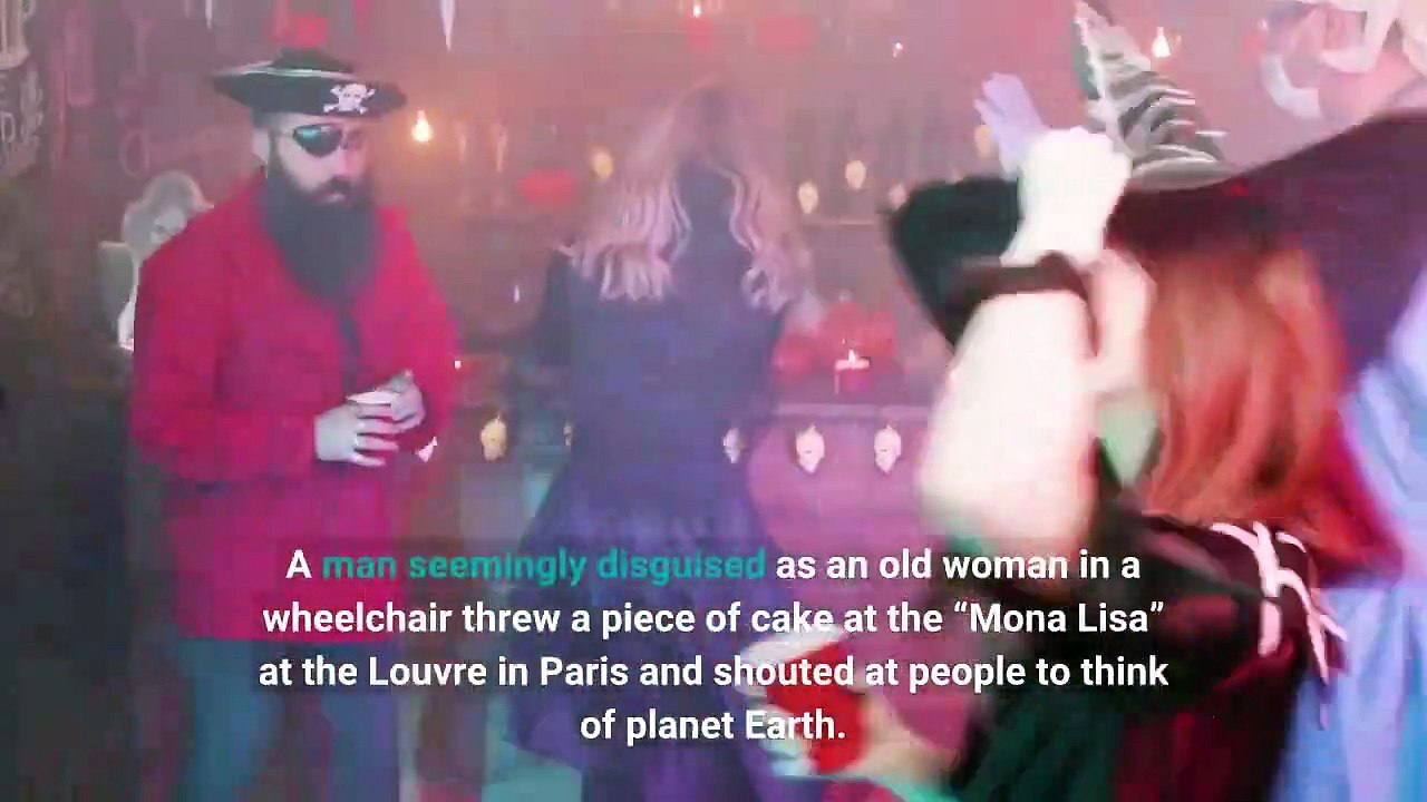 Man in a wig throws cake at the 'Mona Lisa' video Dailymotion