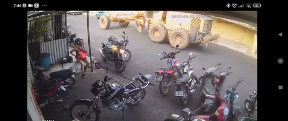 Mechanical Failure Causes Tractor to Push Car Into Workshop