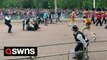 Queen’s jubilee parade shows protesters storming onto the mall before being dragged away by police