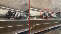 Metroda pes dedirten kavga! Yürüyen merdivenlerden yuvarlansalar da ayrılmadılar