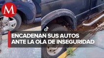 Vecinos de Tlalnepantla resguardan sus autos con cadenas y candados