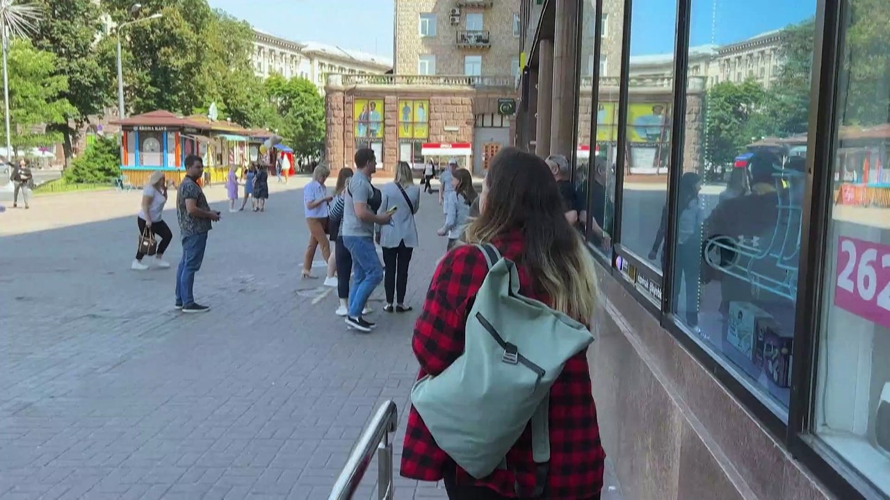 Watch: Kyiv residents seek shelter in underground station as explosions ring out across city