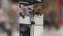 Moment man proposes to Ryanair flight attendant in front of cheering airport crowd