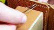 Stitching by hand pockets on a leather wallet - Leathercraft