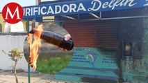 Lanzan bombas molotov a purificadora de agua en Veracruz