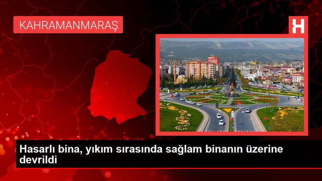Hasarlı bina, yıkım sırasında sağlam binanın üzerine devrildi