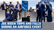 US President Joe Biden trips and falls at Air Force Academy graduation ceremony  | Oneindia News