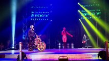 Elderly woman celebrates turning 100 by being driven at by motorbike stunt riders on stage at extreme circus