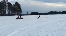 Skier Getting Dragged by Snowmobile Jumps Off Ramp and Crashes