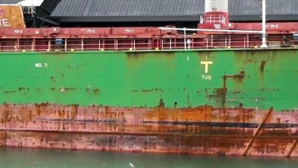 A VESSEL CONTAINING RAW SUGAR DOCKED AT THE REDPATH SUGAR MILL. TORONTO, ON, CANADA.