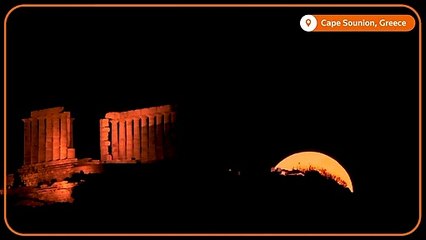 Drone shows 'strawberry' supermoon behind ancient Greek temple