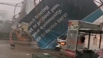 Powerful winds and rain topple billboard in Cambodia