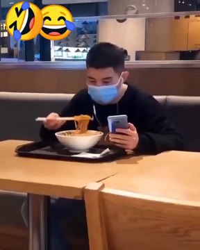 Funny man eating a noodles