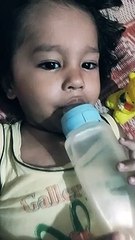 Cute boy drinking water first time