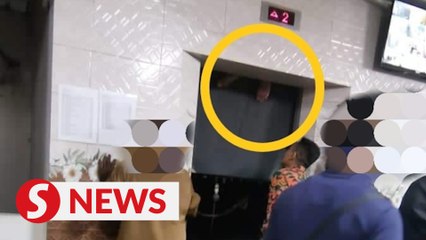 Penang man gets both feet wedged in elevator