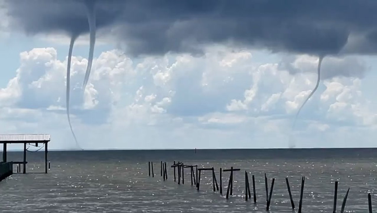 Incredible video shows three waterspouts spinning at once